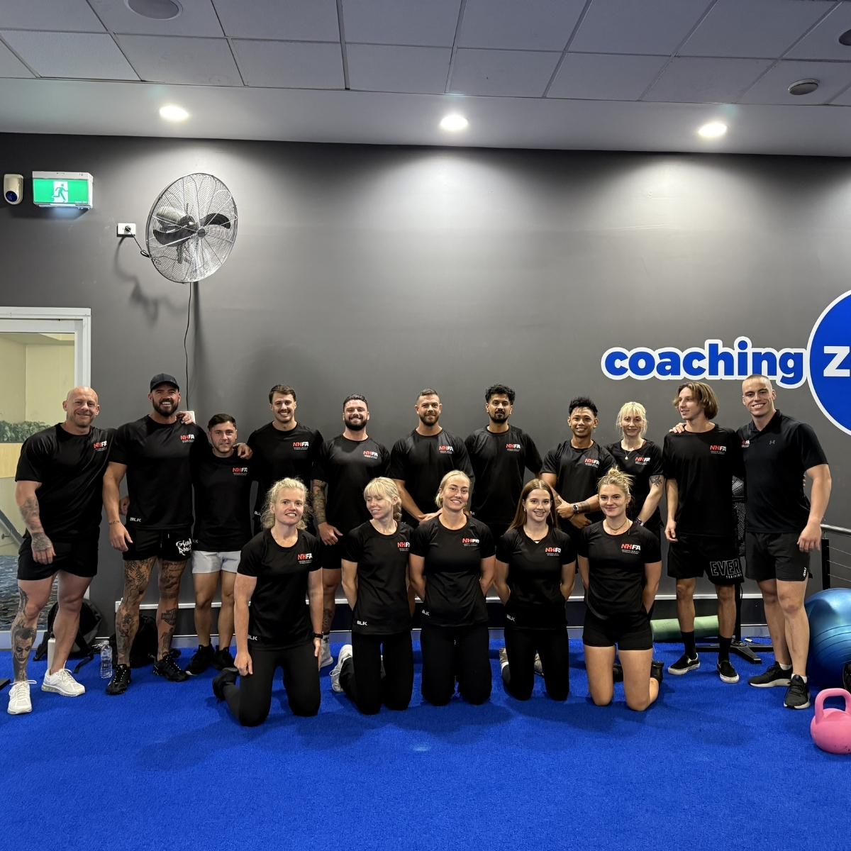 NHFA graduates posing as a group after their course